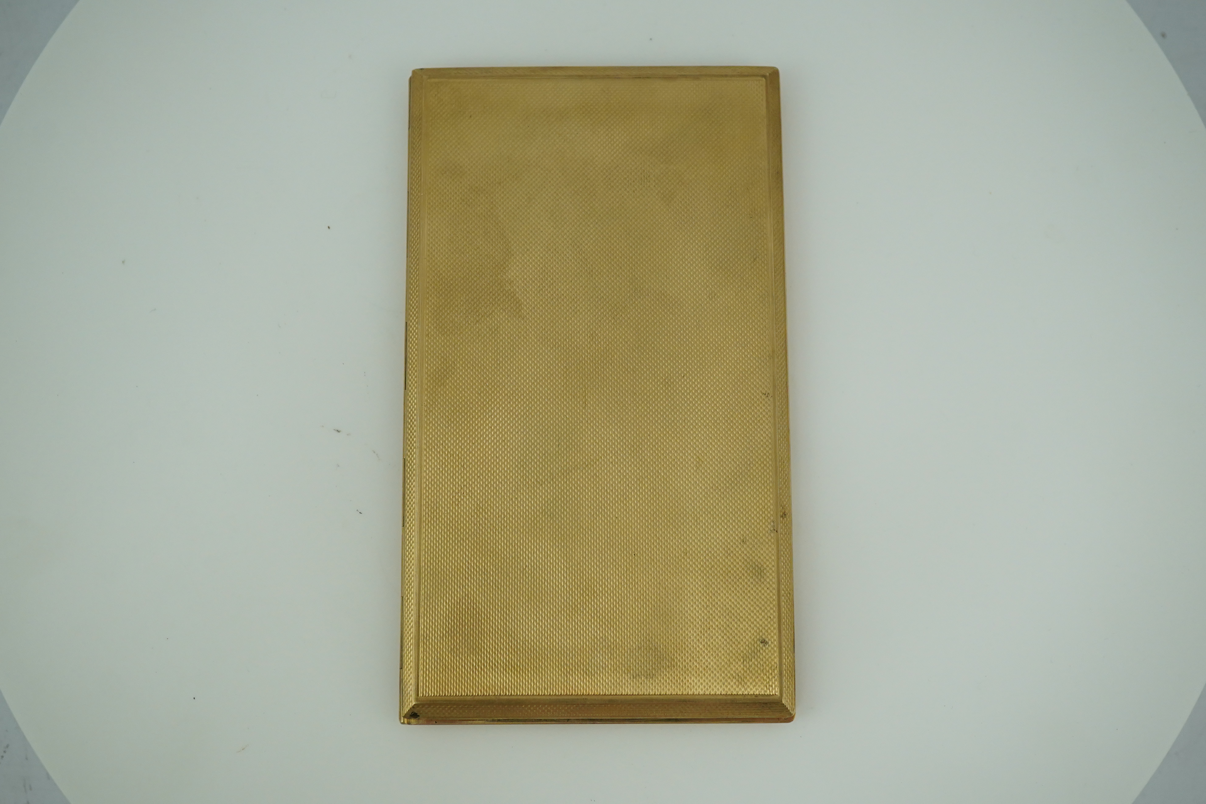 A 9ct gold cigarette case, circa 1950